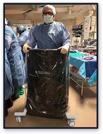 A man wearing lead apron protecting against scatter radiation